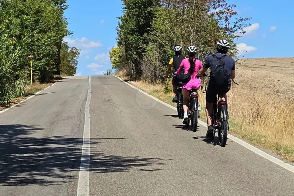 Group relaxing on e-bikes before the return leg to Matera