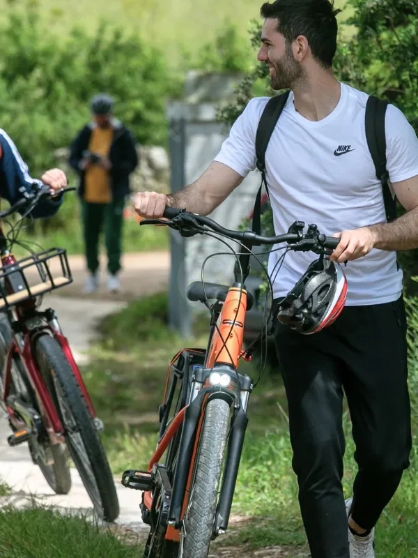 Group arriving at a traditional winery after a scenic e-bike ride