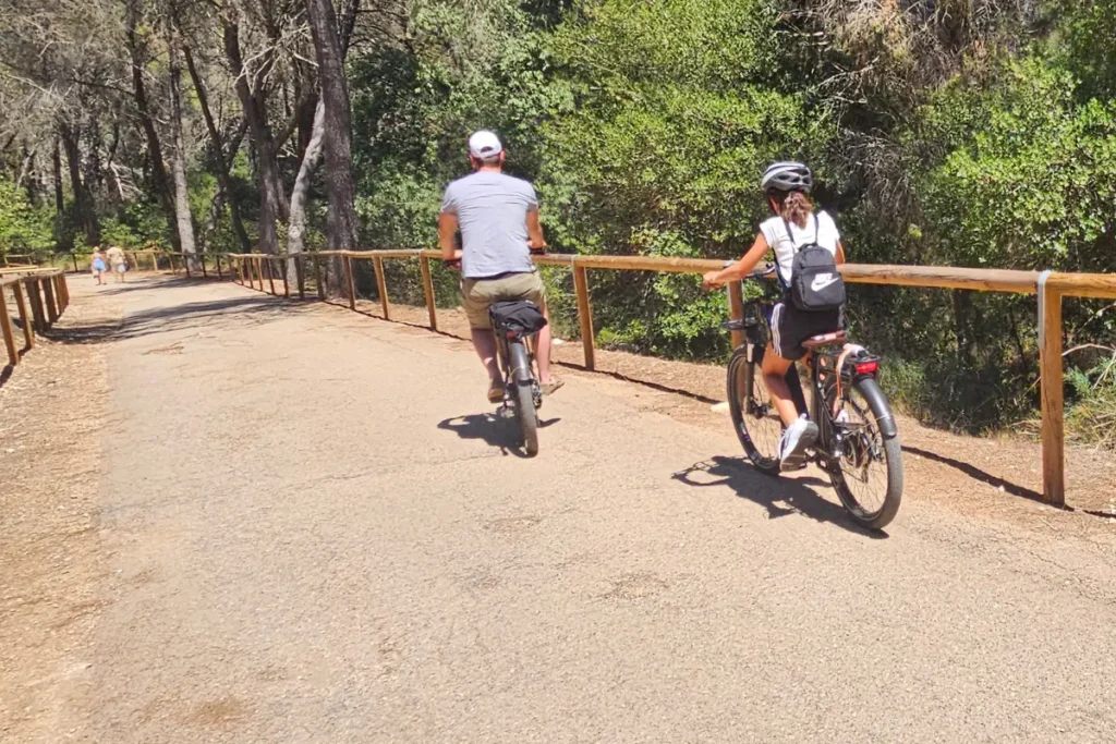 Cyclists riding through hill landscapes near Cassano delle Murge.