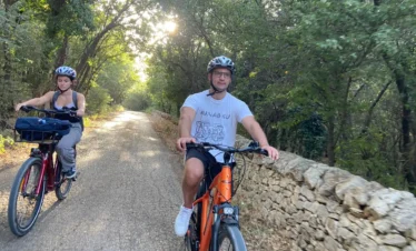 E-bike riders crossing the hills and countryside of the Alta Murgia during a scenic journey.