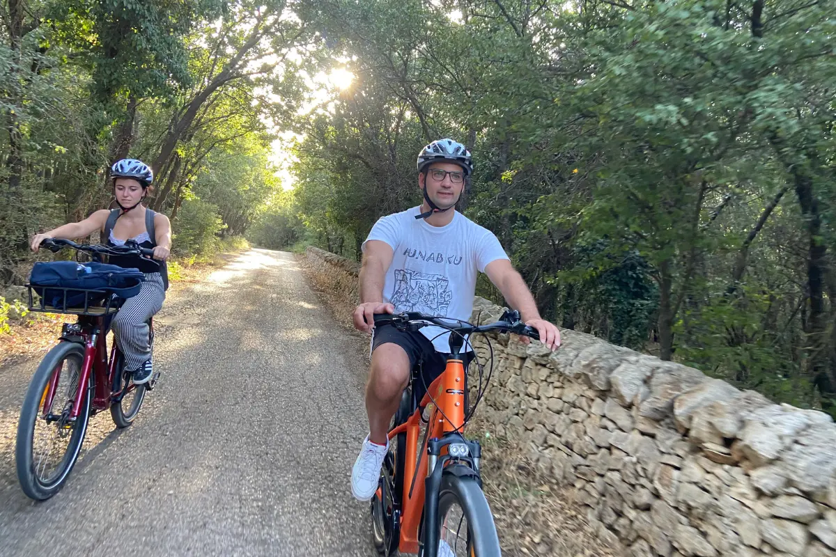 E-bike riders crossing the hills and countryside of the Alta Murgia during a scenic journey.