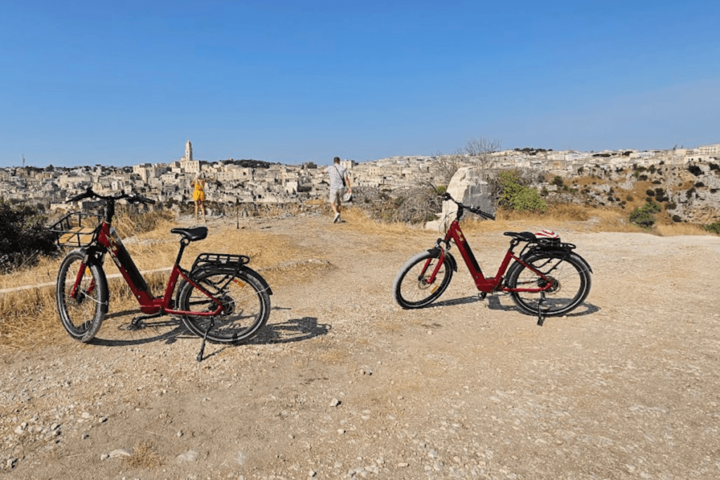 Scenic stop with ancient city of Matera visible across the ravine.